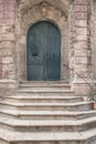 Stone stairs leading to closed door