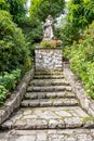 Stone stairs leading to statue of Virgin Mary with baby Jesus Christ in arms Royalty Free Stock Photo