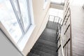 Stone stairs with metal railing indoors Royalty Free Stock Photo