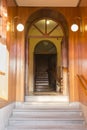 Stone stairs and wooden entrance to a building Royalty Free Stock Photo