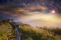 Stone stairs with wooden railing in the mountains at sunset, Taiwan