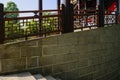 Stone stairway along balustraded colonnade in sunny summer morning