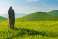 Stone stands in a field, landscape Armenian hills and fields