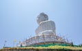 Stone statue of a Buddha on a background of blue sky Royalty Free Stock Photo