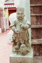 Stone statue of Chinese god in public temple Royalty Free Stock Photo