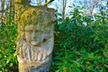 Stone statue of a face of a child