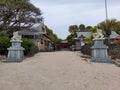 Stone statue gate to Aoshima Shrine