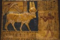 Stone Statue and Golden Painting of Ancient Egyptian Hathor Goddess, illustrated in the form of a cow