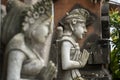 Stone statue with hands in a praying atthe temple\' entrance on Bali, Indonesia