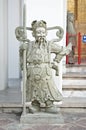 Stone statue hold lancer at Wat Pho