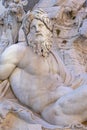 stone statue with human representation belonging to the water fountain installed in Piazza Navona in the Italian city of Rome. Royalty Free Stock Photo