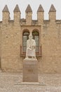 Statue of averroes in front of the Roman city wall of Cordoba