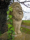 Stone statue of lion on gatepost