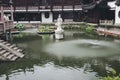 Stone statue in the middle of the pond, city of Shanghai China