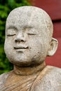 Stone statue of a novice.