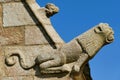 Stone statue representing a monster on the facade of the Saint-Yves church in Plougonven Royalty Free Stock Photo