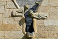 Stone statue representing monsters on the facade of the Saint-Yves church in Plougonven Royalty Free Stock Photo