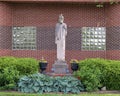 Stone statue of Reverend Charles Nerinckx on the campus of Nerinx Hall in Saint Louis, Missouri.