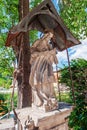 Stone statue of the sacred heart of Jesus on a city street. Cesky Krumlov Czech Republic Royalty Free Stock Photo