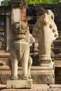 Stone statues guarding the ruins of the Hindu temple in the Phimai Historical Park in Nakhon Ratchasima, Thailand. Royalty Free Stock Photo
