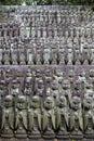 stone statues of Ksitigarbha bodhisattva (Jizo) at Hasedera Temple, Kamakura, Japan on a rainy day