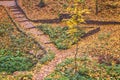 Stone steps in an autumn park strewn with yellow leaves Royalty Free Stock Photo