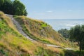 Stone steps down track up Mount Maunganui with view beyond to Pacific Ocean