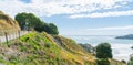 Stone steps down track up Mount Maunganui with view beyond to Pacific Ocean