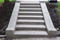 Stone steps of gray granite blocks on a slope. Royalty Free Stock Photo