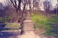 Stone steps and iron rails go up in the park. Royalty Free Stock Photo