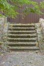 Stone steps leading into blank fence. Wrong path chosen