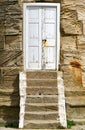 Steps up to a sandstone lighthouse door. Whitby, North Yorkshire.