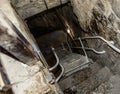 Staircase in the dungeon. Stone steps to the basement. Royalty Free Stock Photo