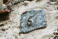 Stone street sign with number six Royalty Free Stock Photo