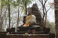 Stone stupa and big buddha at Archaeological Park of Si Satchanalai Buddhist temples, Thailand Royalty Free Stock Photo