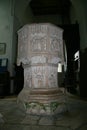 Stone suffolk font at St Mary`s and St Peter`s Church, Kelsale