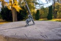 Stone sundial in Autumn Park