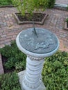 Stone sundial garden brick walk Royalty Free Stock Photo