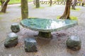 The Stone table and bench in the garden. Royalty Free Stock Photo