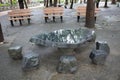 The Stone table and bench in the garden. Royalty Free Stock Photo