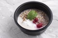 Stone table and Low-fat cottage cheese with buckwheat and berries, vegan meal in food box for proper nutrition