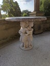 Stone table with statue pedestal