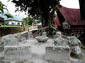 Stone tables and chairs at Huta Siallagan Ancient Batak Village on Lake Toba, Pulau Samosir. Indonesia