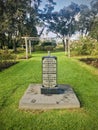 Stone Tablet for Drinking Water in the rose garden. Vertical photo image. Royalty Free Stock Photo