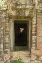 Stone temple doorway leading to fallen rocks