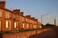 Stone terraced houses in early morning sunlight