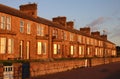 Stone terraced houses in early morning sunlight