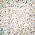 Stone texture. Vector illustration. Cut of white stone interspersed with colored gems - orange and blue.