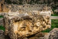 Stone Theater masks in Myra Ancient City. Ancient Myra Theater in background. Demre, Antalya, Turkey Royalty Free Stock Photo