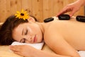 Stone therapy. Woman getting a hot stone massage at spa salon Royalty Free Stock Photo